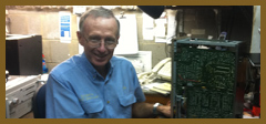 Peter White at his repair bench